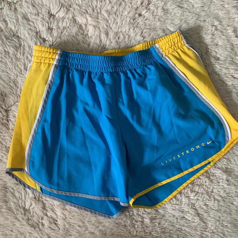 Blue and yellow Nike Livestrong running shorts